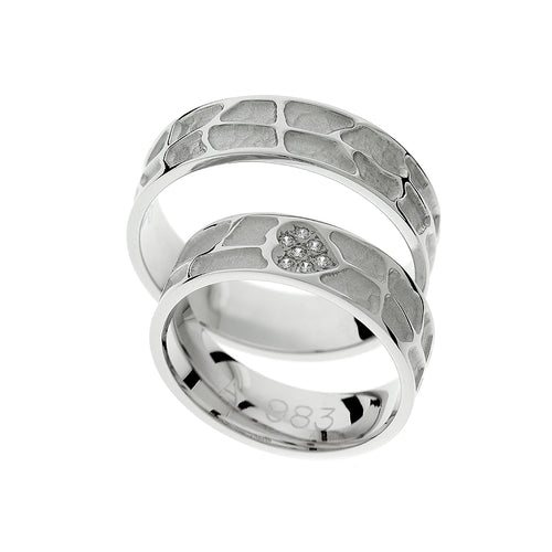 Wedding ring with heart detail and stones