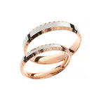 White and rose gold wedding rings with circles