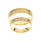 Yellow gold wedding ring with flat line around it