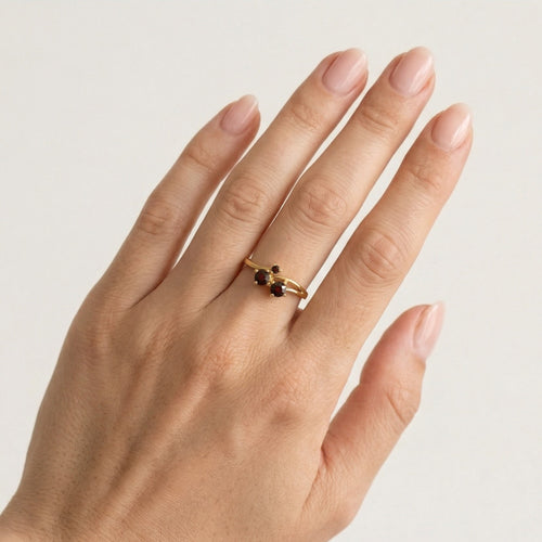 Round fine step cut garnet ring