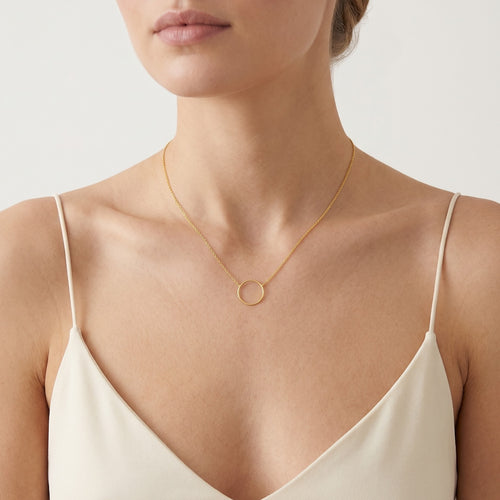 Modern gold necklace with a circle