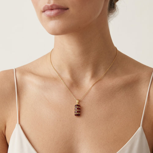 Pendentif en or jaune avec trois rangées de grenats