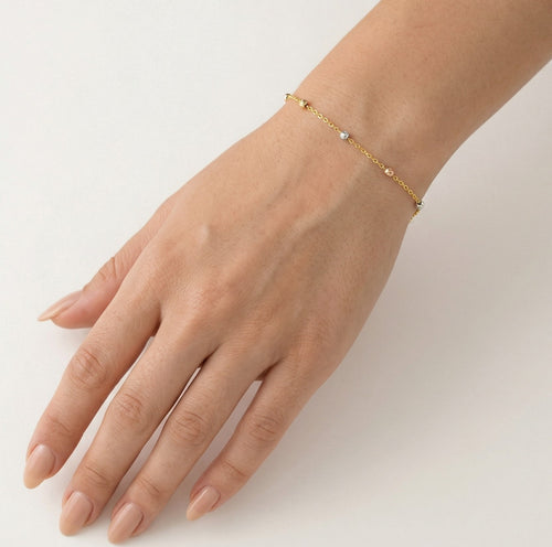 Simple gold bracelet with marbles