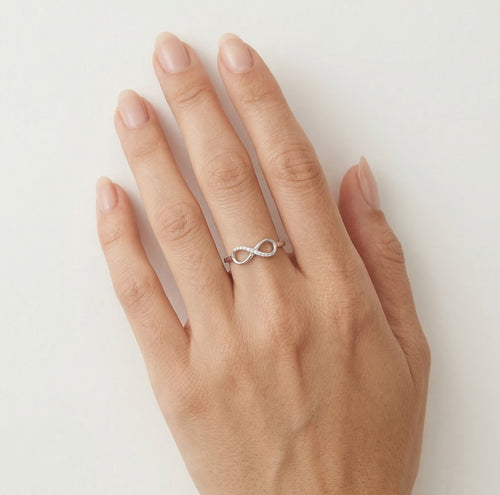 White gold infinity ring with diamonds