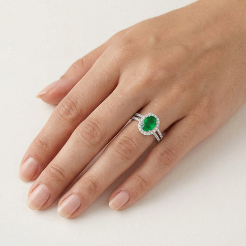 Elegant white gold diamond and emerald ring