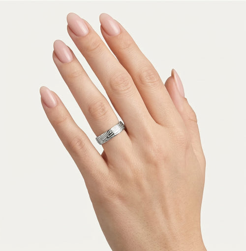 White gold wedding ring with engraved lines