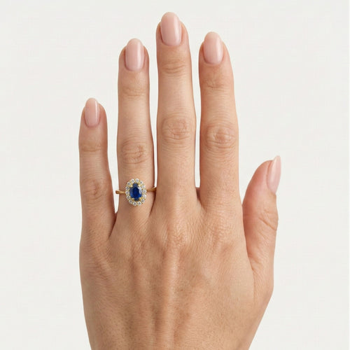 Oval blue quartz halo gold ring