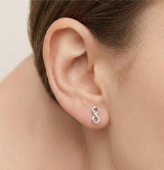 Infinity cubic zirconia studs white gold earrings
