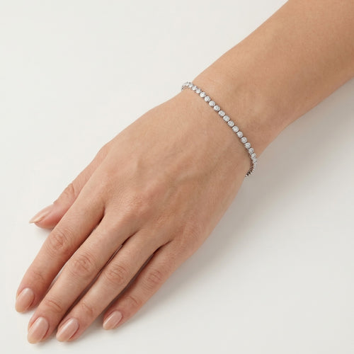 Diamantový tenisový náramek v obrubovém zasazení