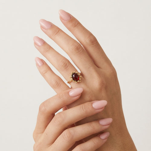 Garnet oval fine step cut gold ring