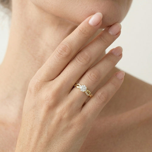 Yellow gold ring with wave shaped design