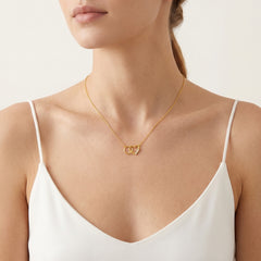 Gold necklace with heart and ring