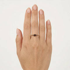 Stylish yellow gold ring with three garnets