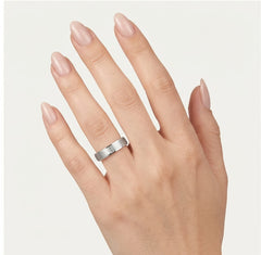 White gold wedding ring with bezel set and baguette stone