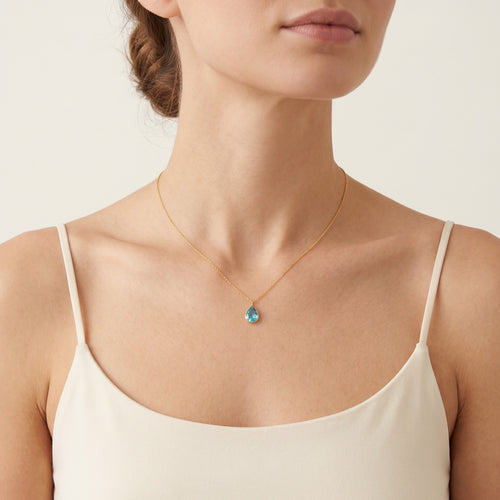 Fine gold drop-shaped necklace with topaz