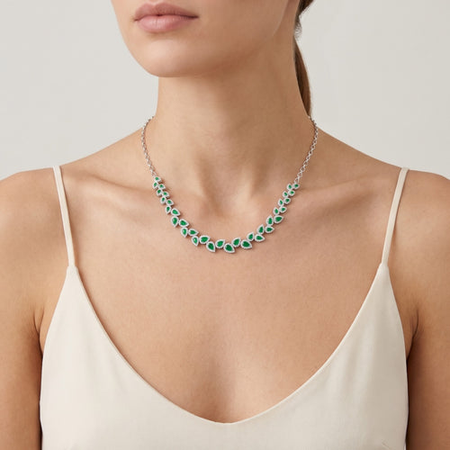 Sterling silver necklace with emerald halo