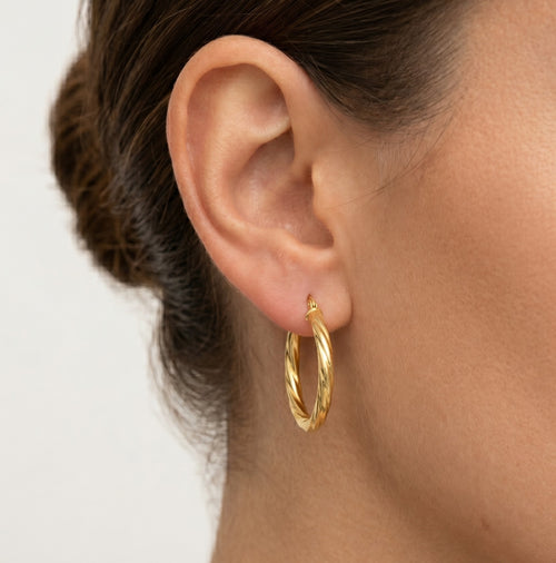 Pendientes de aro tubo retorcido en oro amarillo