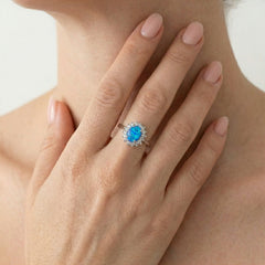 Bague halo en argent sterling avec opale bleue