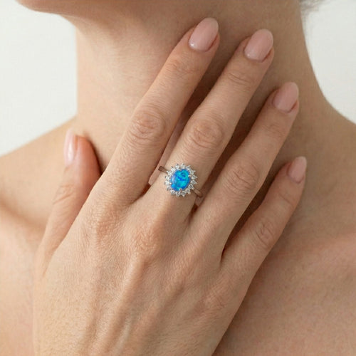 Bague halo en argent sterling avec opale bleue
