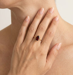 Garnet oval cut gold ring on bar set