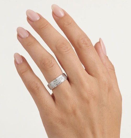 White gold wedding ring with wave design