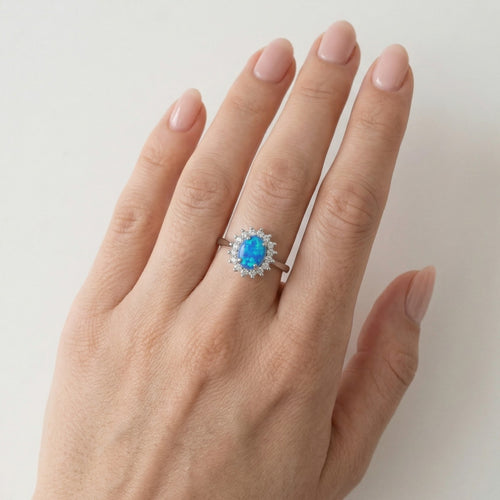 Bague halo en argent sterling avec opale bleue