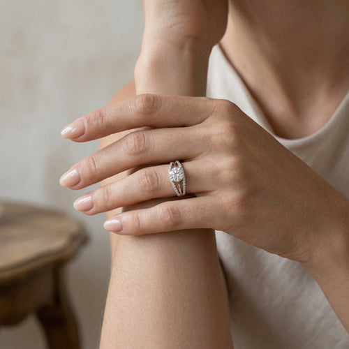 White gold ring with central cubic zirconia and side zircons
