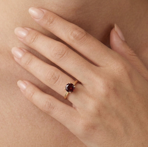 Sophisticated round fine step cut garnet ring