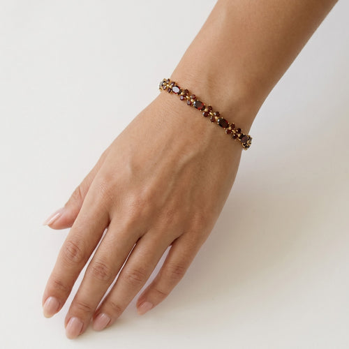 Elegant garnet bracelet with oval and round cut gems