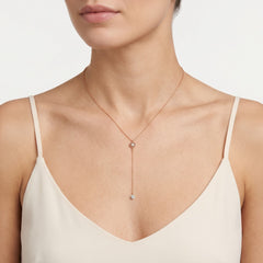 Rose gold necklace with dangling diamond
