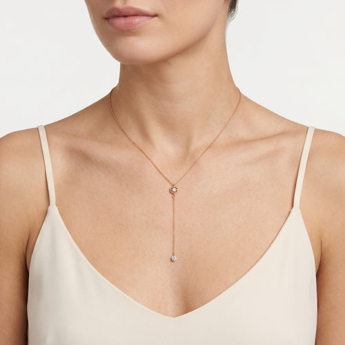 Rose gold necklace with dangling diamond