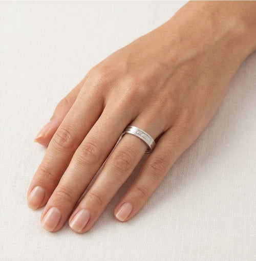 White gold wedding ring with baguette cut stone