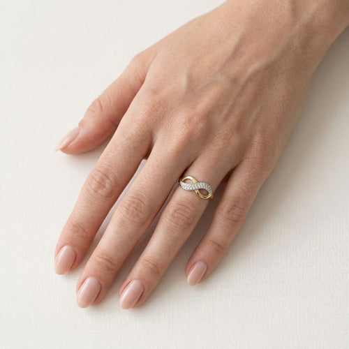Yellow and white gold infinity ring with cubic zirconia
