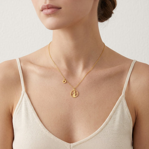Gold-Halskette mit Silhouette einer schwangeren Frau