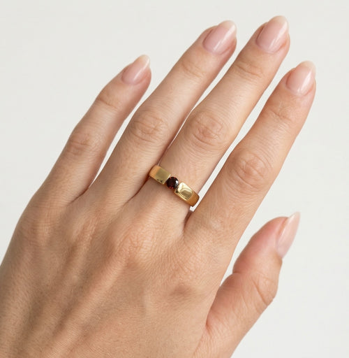 Chic tension set garnet gold ring