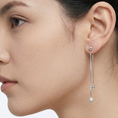 White gold earrings with a hanging balls