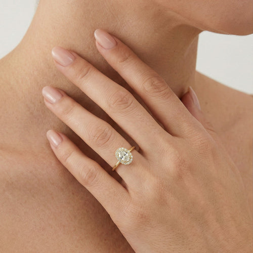 Halo oval cubic zirconia gold ring