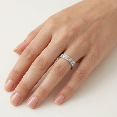 Modern white gold wedding ring with engravings lines
