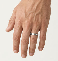 White gold wedding ring with baguette cut stone