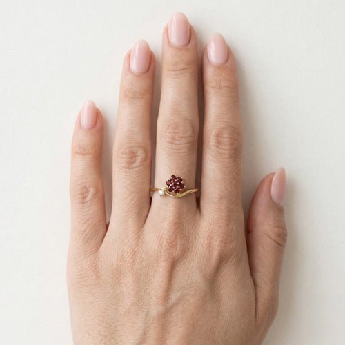 Yellow gold garnet flower ring