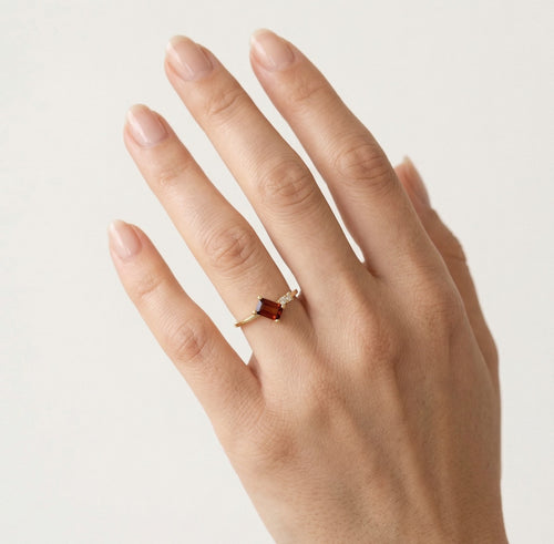 Emerald step cut garnet ring with cubic zirconia