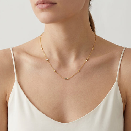 Gold necklace with balls and rectangular zircons