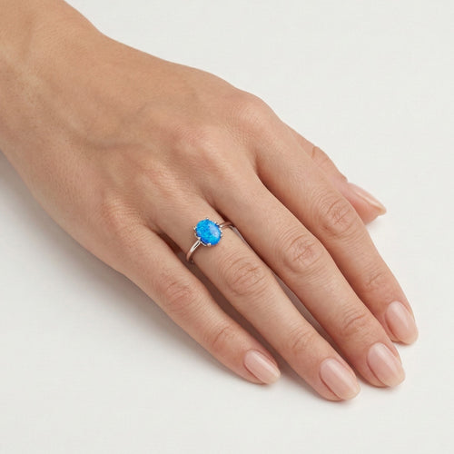 Blue opal in a crown ring