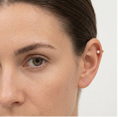 One pearl gold piercing