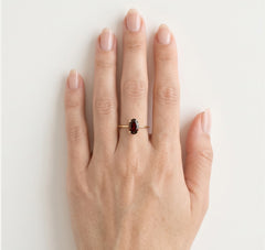 Solitaire garnet ring in yellow gold