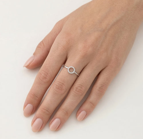 White gold ring with small circle of diamonds