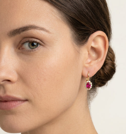 Oval rubellite gold earrings
