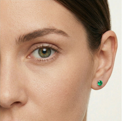 Silver stud earrings with round synthetic emerald