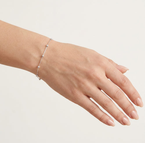 Náramek z bílého zlata s jednoduchými kuličkami