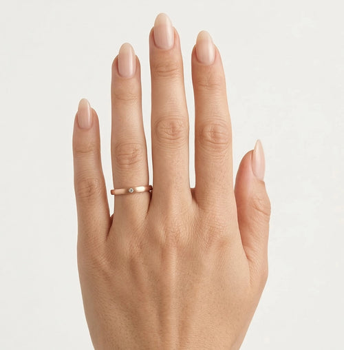 Matte finish rose gold wedding ring with round cut stone